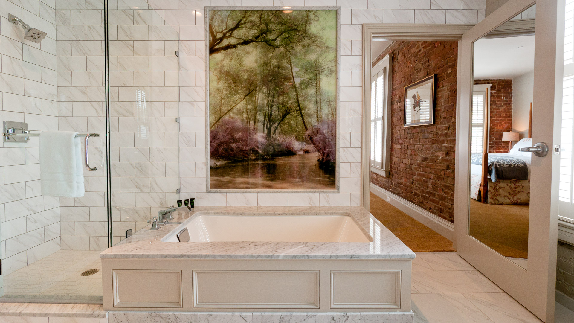 a large white bathtub in a bathroom