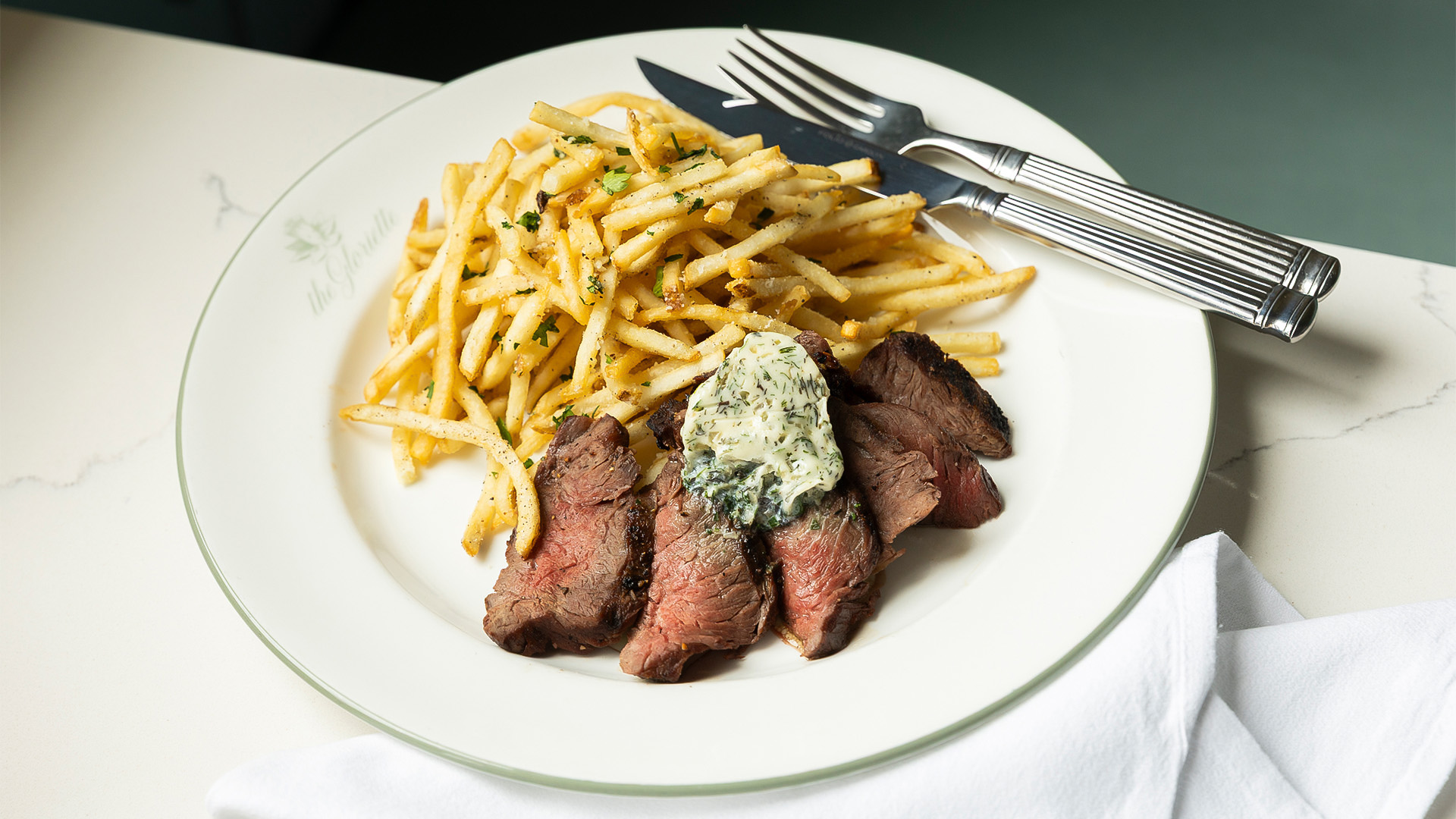 a plate of food with fork and knife