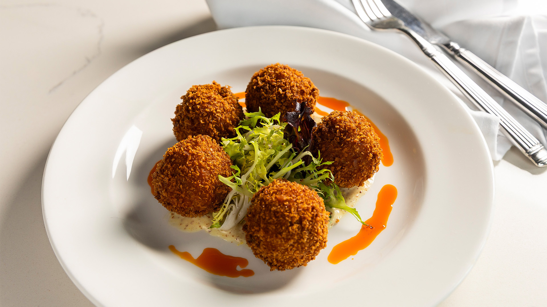 a plate of food with a fork and knife