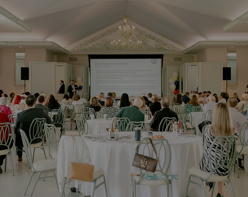 a group of people sitting at tables in a room