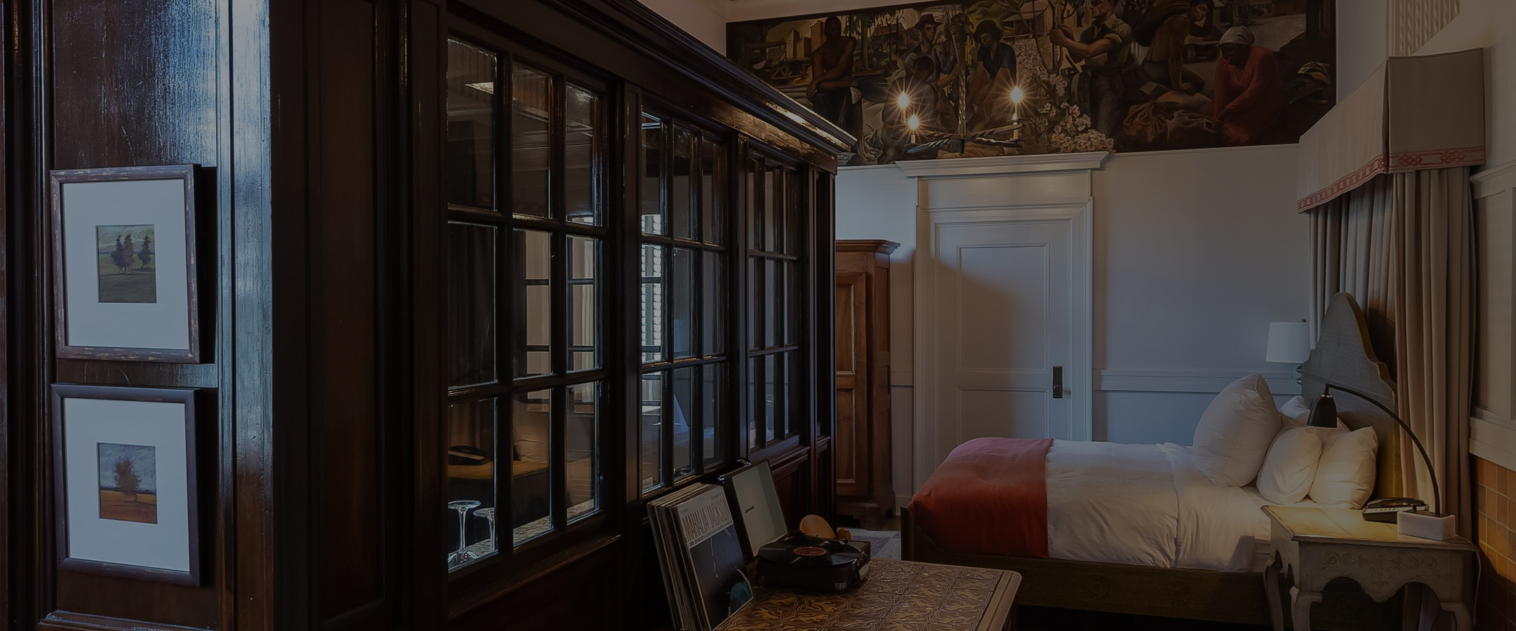 a room with a bed and a record player