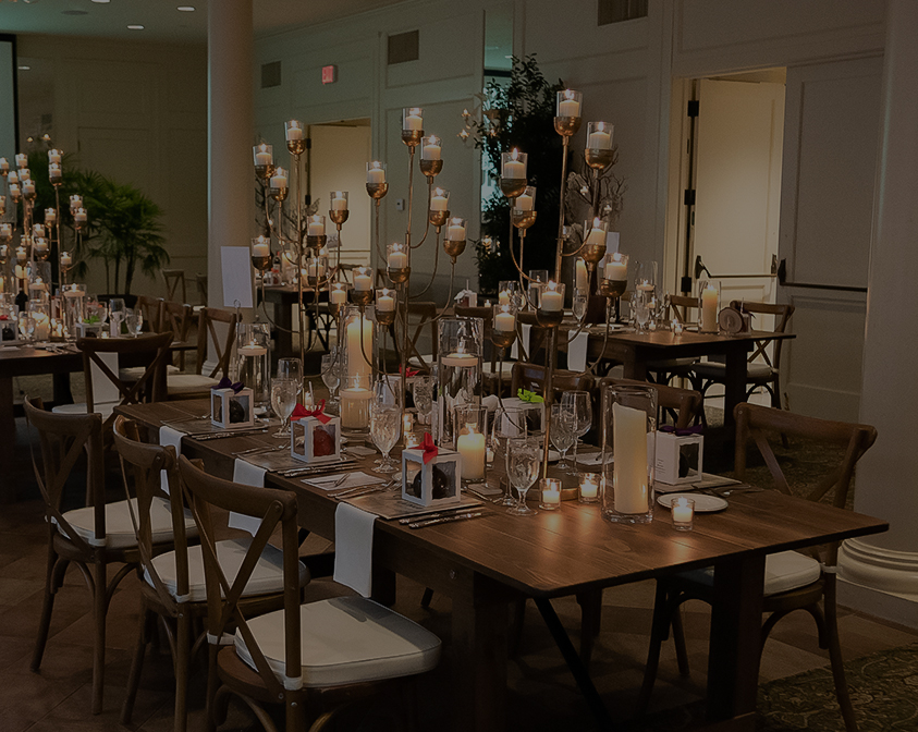 a table with candles and glasses