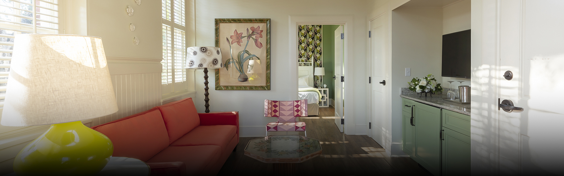 a living room with a couch and a lamp