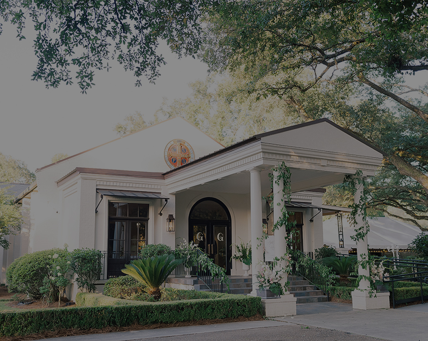 a white house with columns and a large front door