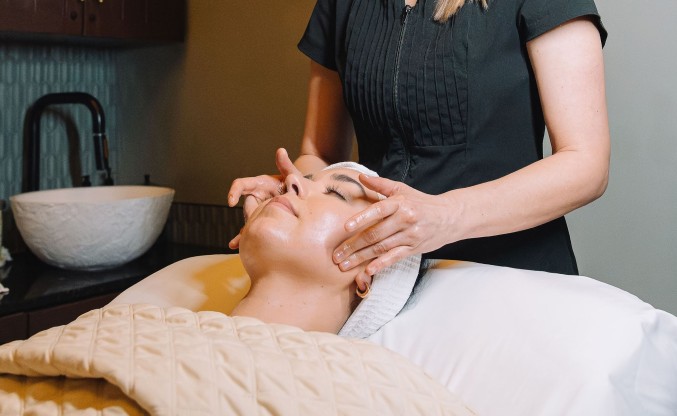 a woman getting a face massage