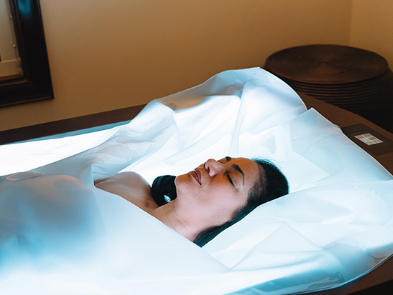 a woman lying in a bed