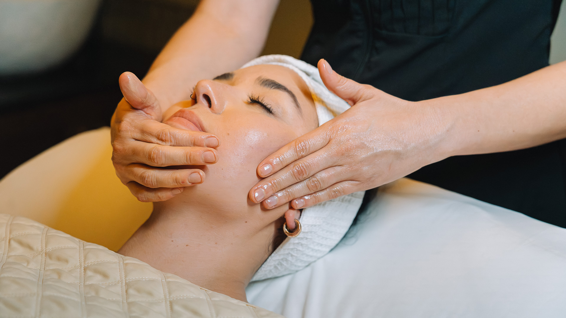 a woman getting a face massage