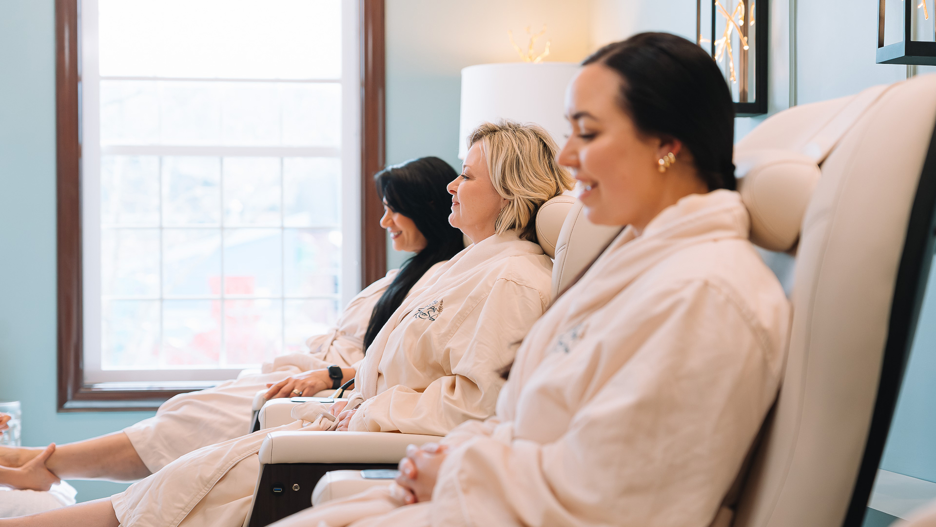 a group of women sitting in chairs