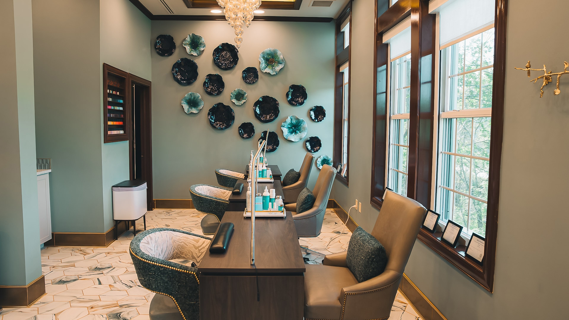 a room with chairs and a chandelier