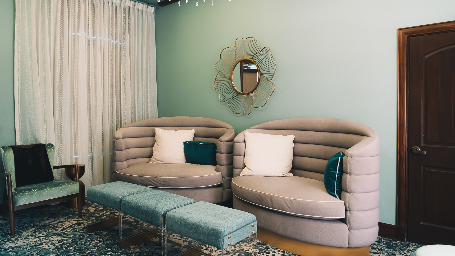 a room with two chairs and a mirror
