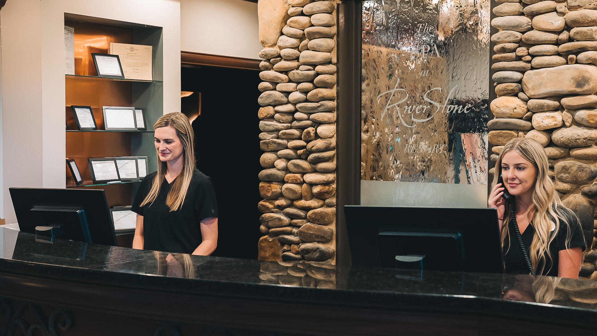 a woman standing behind a counter