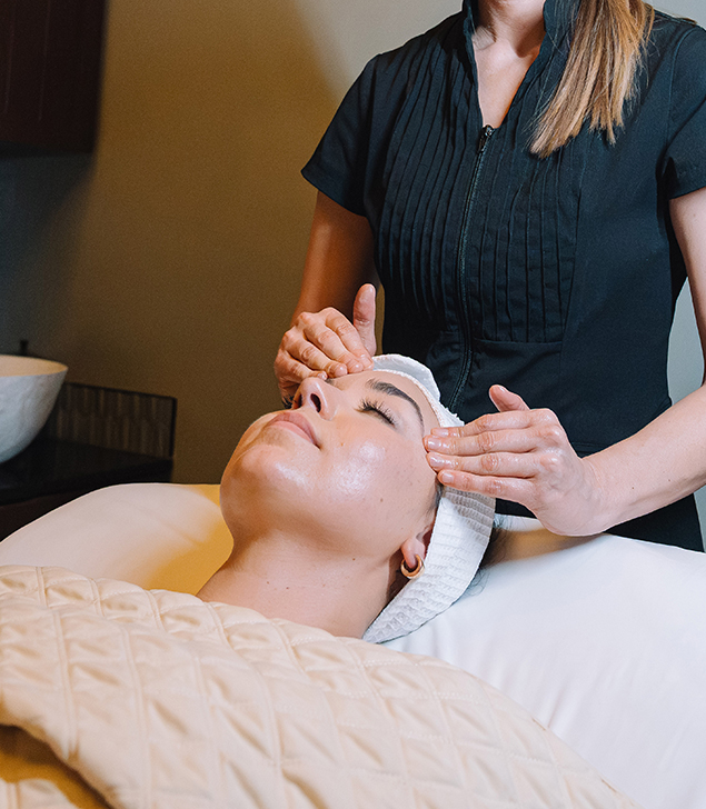 a woman getting a face massage