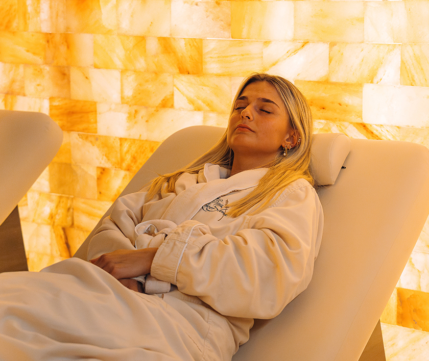 a woman lying in a bathrobe