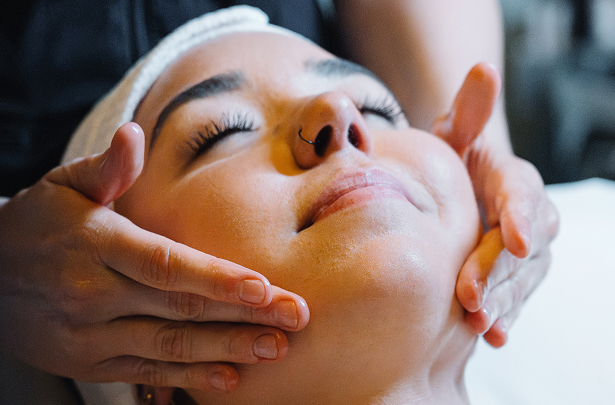a person receiving a face massage