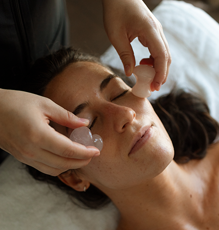 a woman receiving a face massage