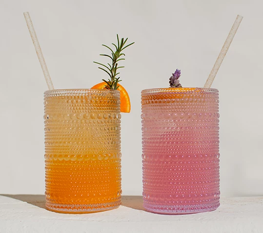two glasses with liquid in them