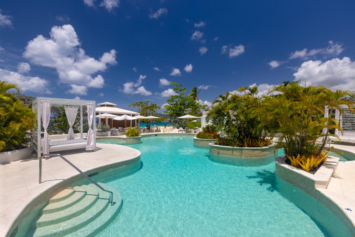 a pool with a white canopy over it