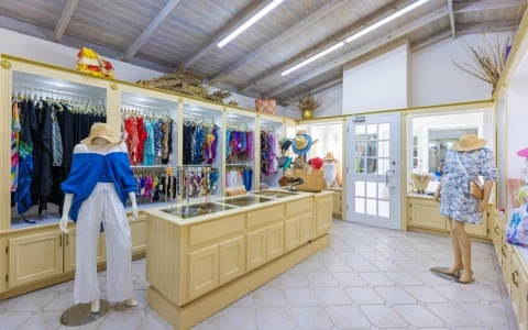 a store with mannequins in front of a display