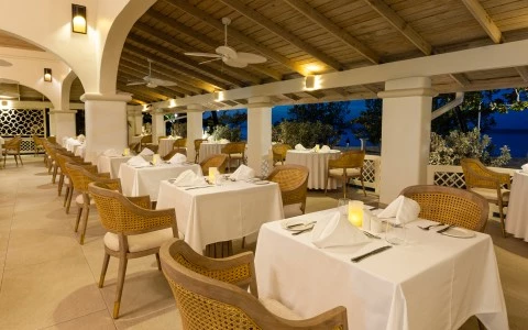a restaurant with tables and chairs