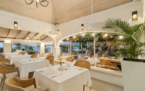 a restaurant with tables and chairs