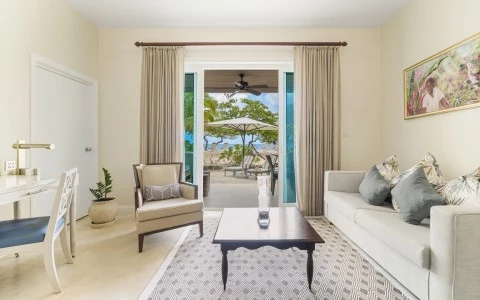 a living room with a table and chairs