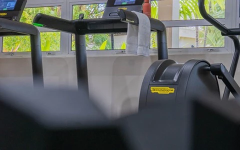 a group of exercise machines in a gym