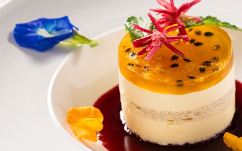 a dessert with a jelly and flowers on top