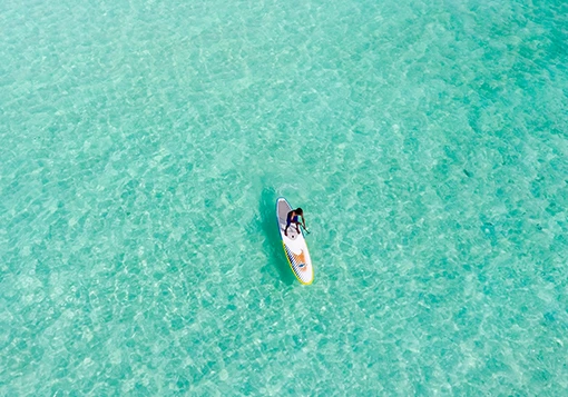 aerial view of a man in the middle of the sea