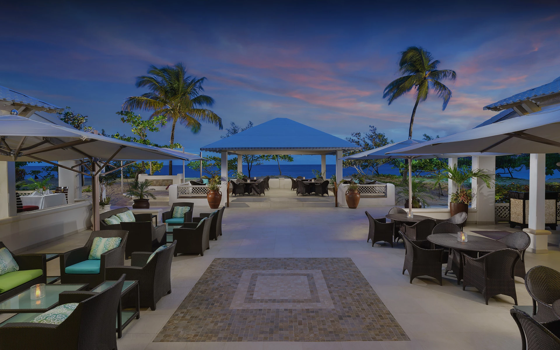 view of hotel outdoor courtyard area during sundown