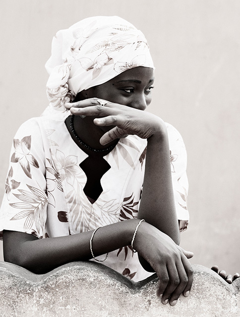 Portrait of a black woman with white clothes 
