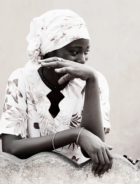 Portrait of a black woman with white clothes 