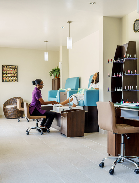 a woman receiving a pedicure
