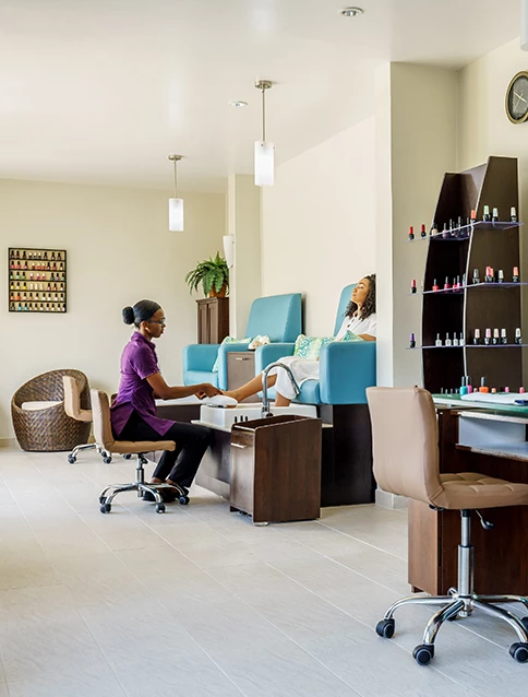 a woman receiving a pedicure