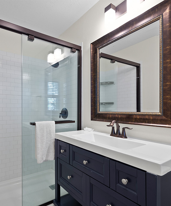 a bathroom with a mirror and sink