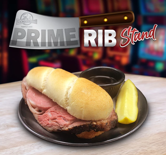 a sandwich with meat and pickle on a plate