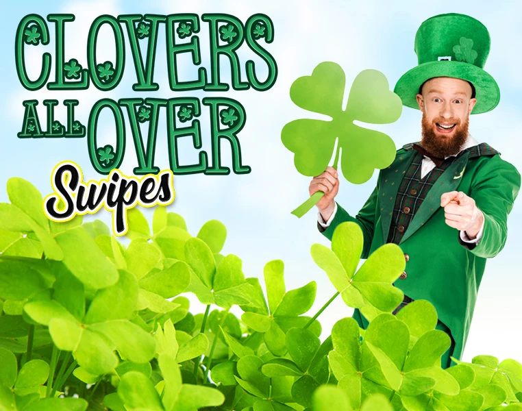 a man in a green suit holding a four leaf clover