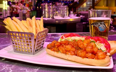 a plate of food and a glass of beer