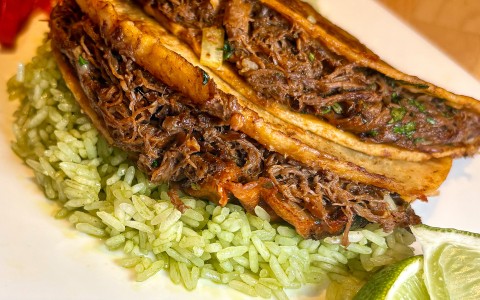 a plate of food with rice and meat