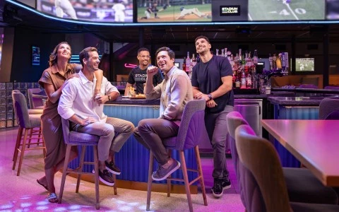 a group of people sitting at a bar