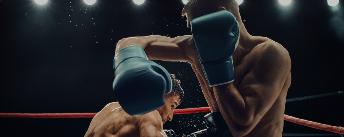 two men wearing boxing gloves