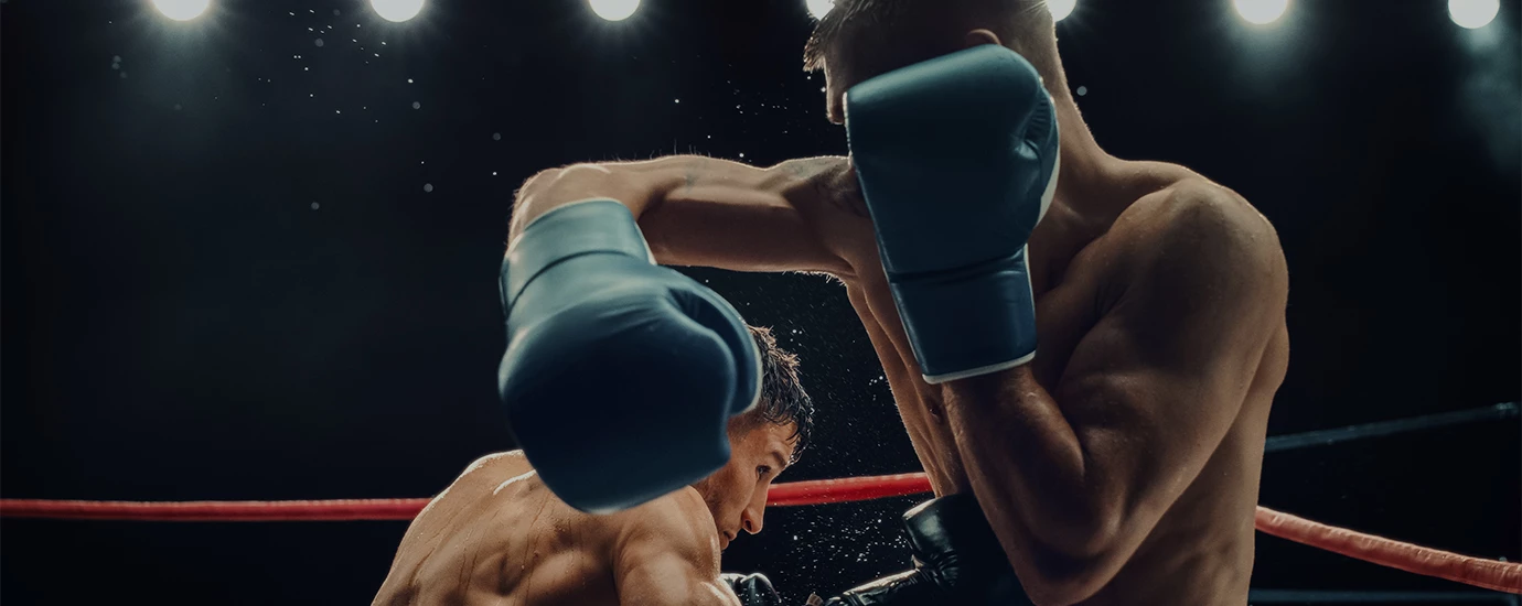 two men wearing boxing gloves