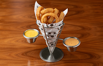 a hot dog with vegetables and fries on a plate