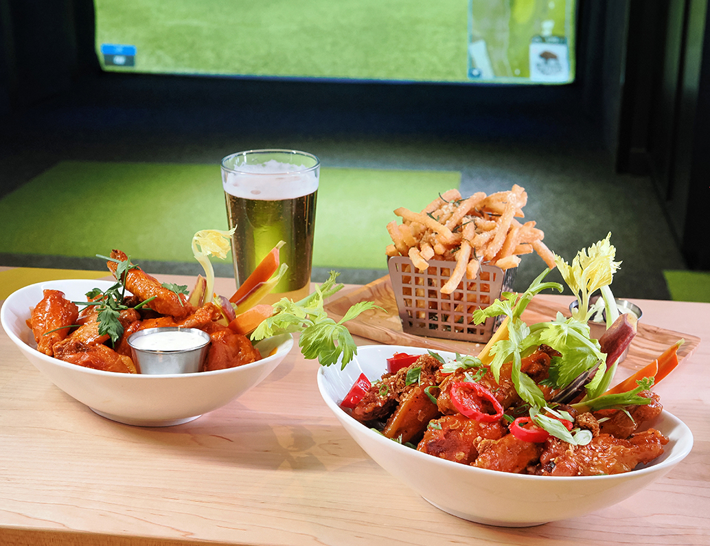 a bowl of food and a glass of beer