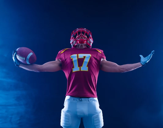 a football player holding a football