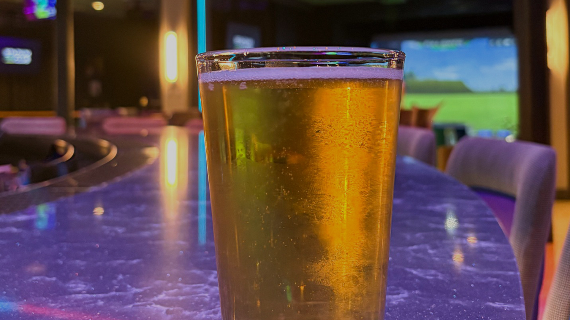 a glass of beer on a table