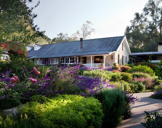 a house with a garden and a path