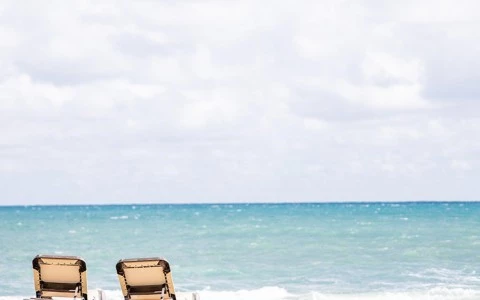 chairs on a beach by the ocean