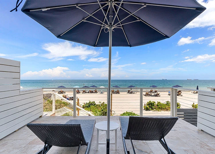 chairs and umbrella on a deck