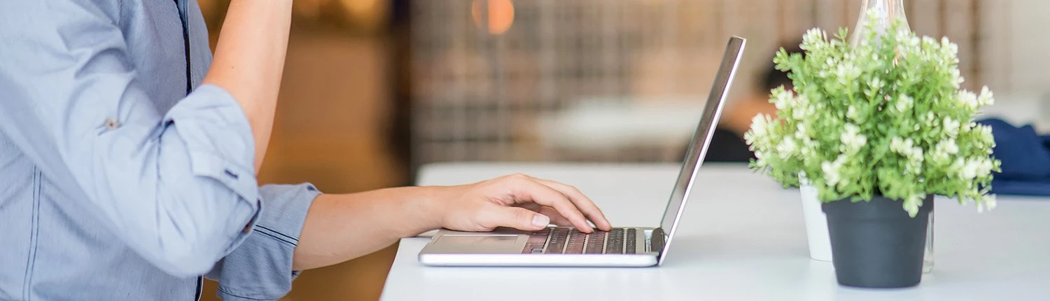 woman typing on a computer