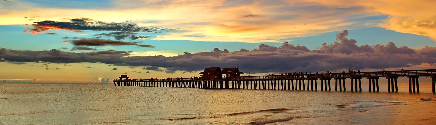 sunset sky with pier over the water
